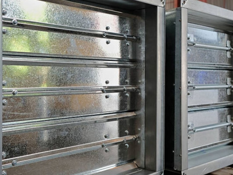Close-up of metal louvers used in motorized dampers HVAC systems for airflow control.